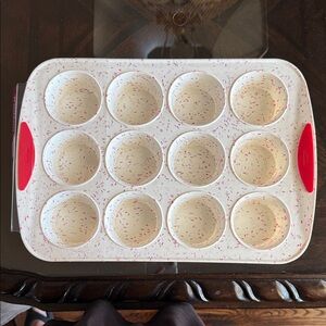 Non-Stick Silicone Muffin Pan with Red Handles. Brand new never used